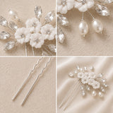 Four-panel close-up collage of a bridal hair accessory set on a warm beige background. The set includes white faux-floral flowers with silver rhinestone centers, clear faceted crystal leaves, white pearl drops, and two silver hair pins shown separately.